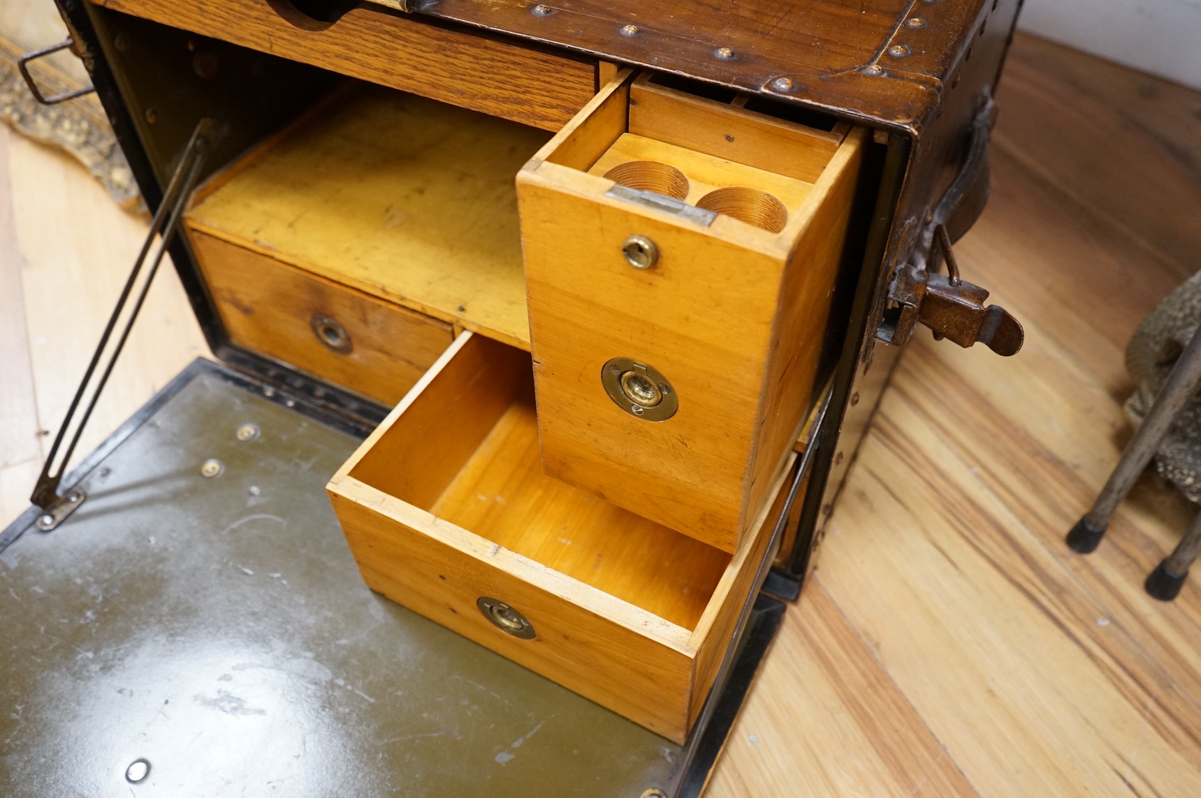 A Hartman Trunk Company metal travelling secretaire with The Grand Hotel, Paris label, with key, 52cm wide
